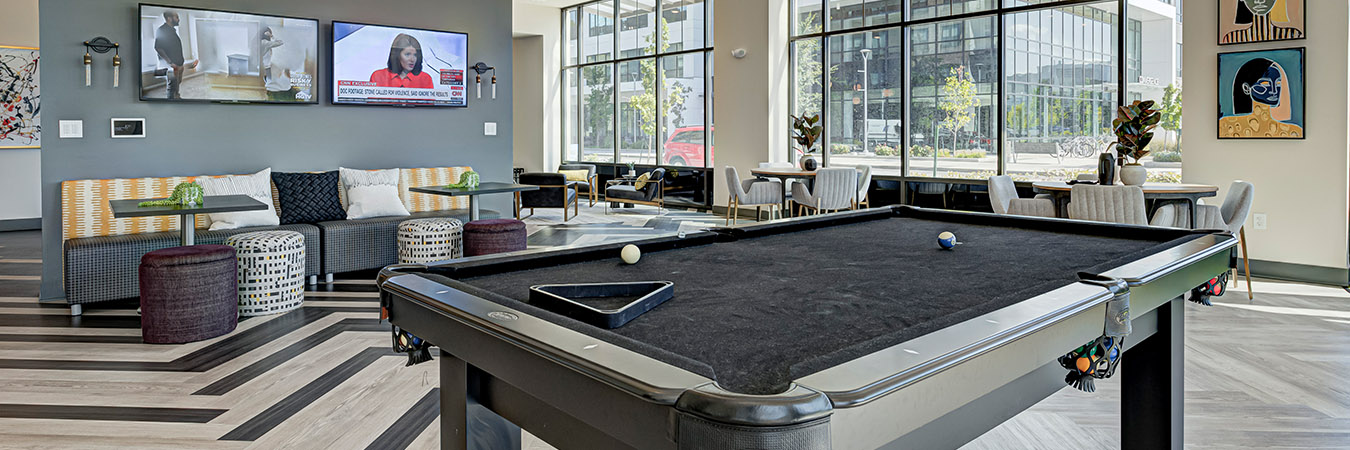 Apartment community clubhouse with pool table
